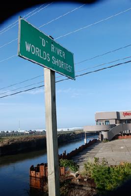 A roadside sign proclaims the D River as the world's shortest. Photo courtesy www.oregoncoasttoday.com