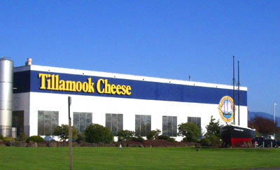 Tillamook Cheese factory, prominently featuring a small black schooner that's a replica of the Morning Star, the ship that Tillamook settlers built