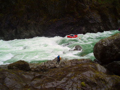 Rafters tackle the Class V rapids at the legendary "Green Wall" on the Illinois River, not far from the area in which "Crazy Hugo" trapped and hunted.