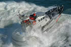 US Coast Guard 47-foot motor lifeboat takes on a heavy sea off Cape Disappointment.