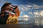 The remains of the barque Peter Iredale as they appear today, jutting out of the beach sands on Clatsop Spit at Warrenton as they have since 1906. In 1960, the wreck nearly was lost to a man who claimed he owned it.